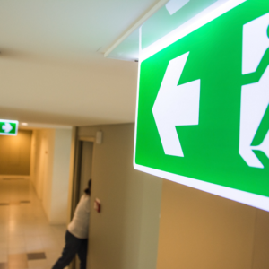 person following the exit signs