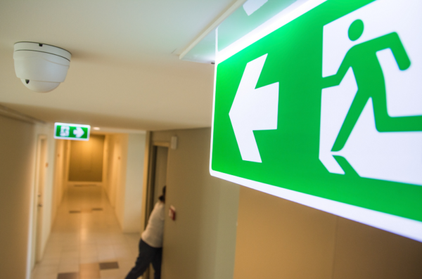 person following the exit signs