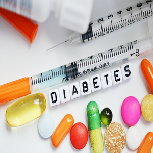 tablets, pills, and letters spelling out diabetes