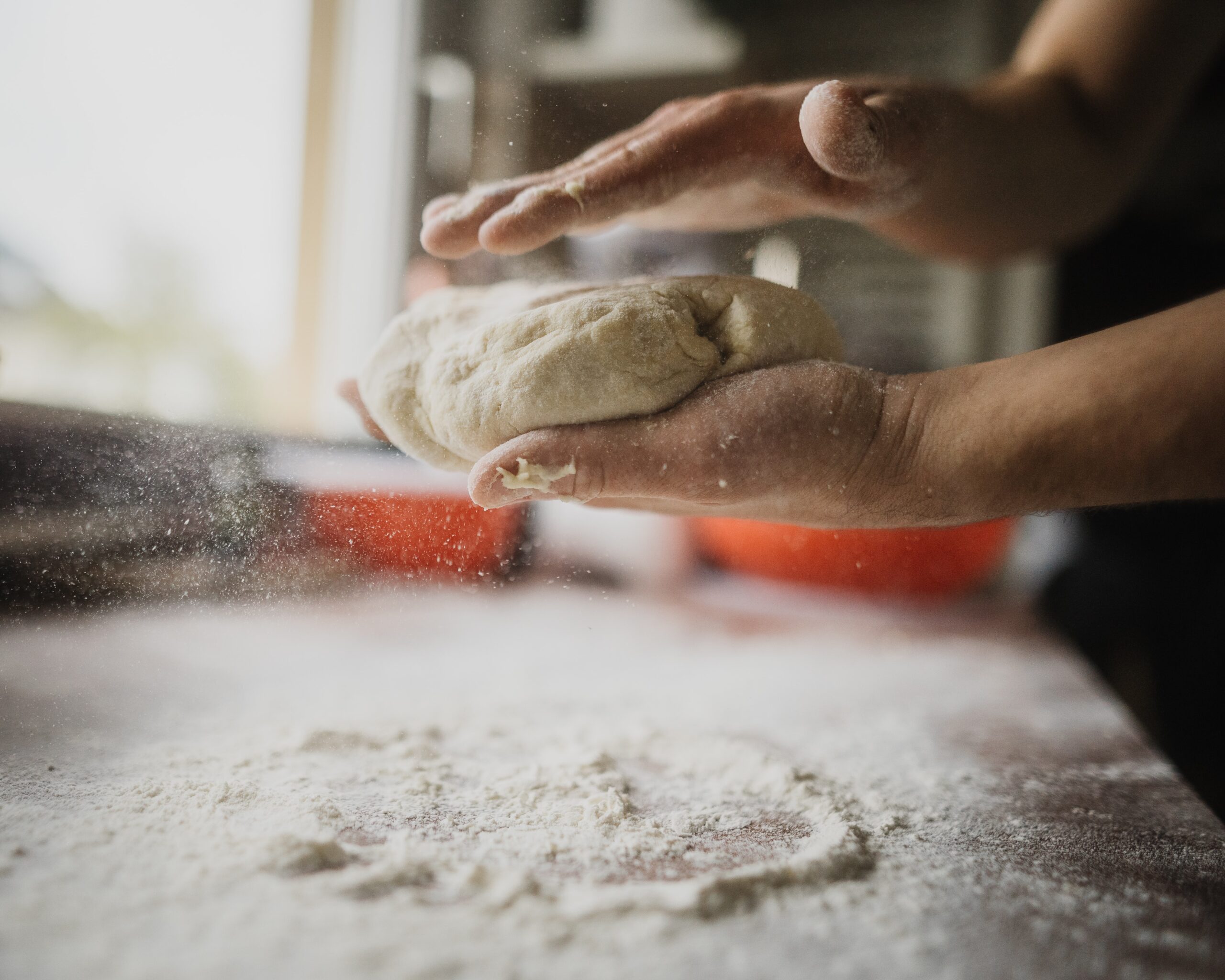 person handling dough