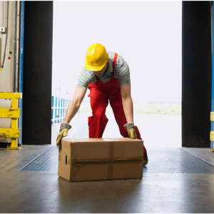worker in a hard hat moving a box